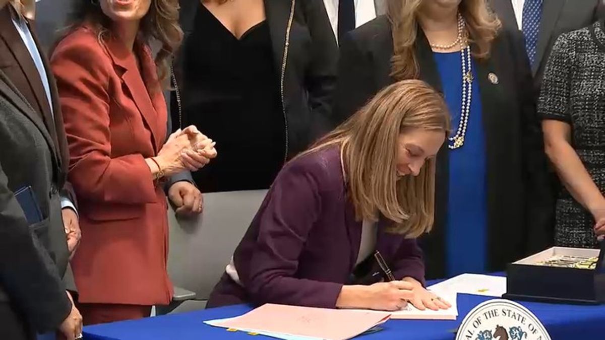 NJ Gov. Mikie Sherrill signs law banning ICE agents, police from ...