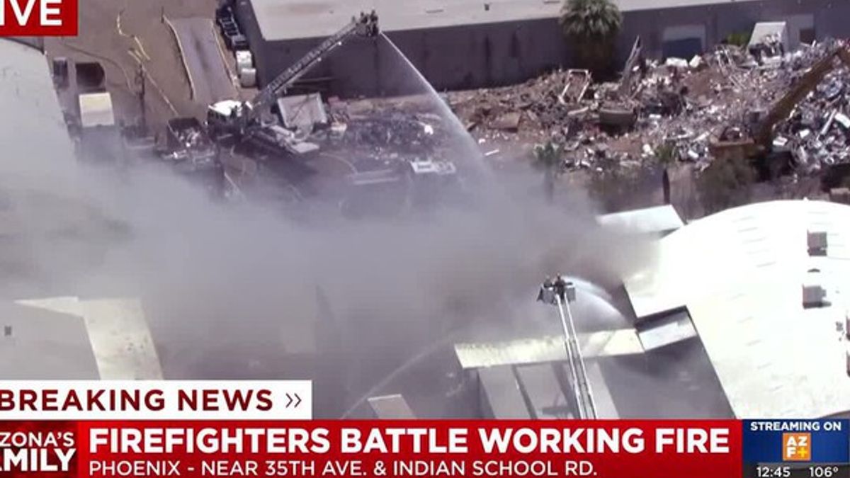 Firefighters battle large structure fire in west Phoenix