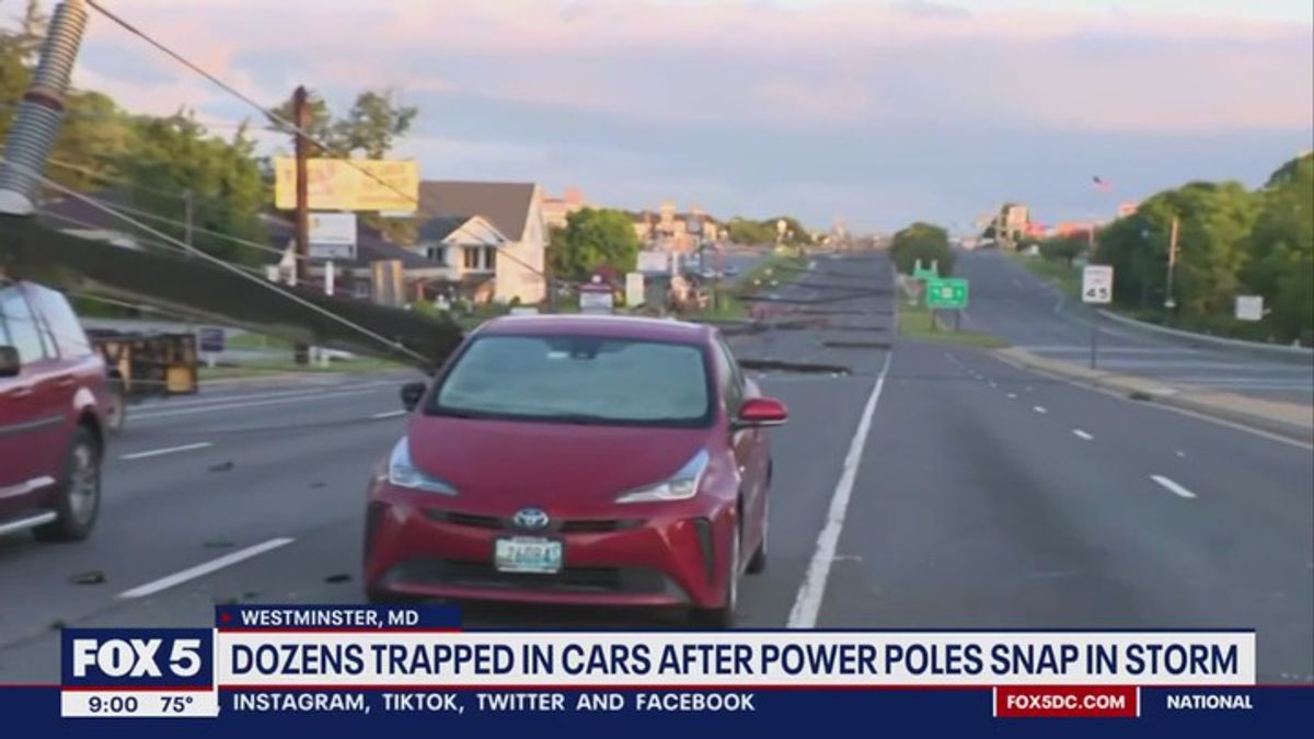 Dozens trapped in cars after power poles snap in severe storms ...