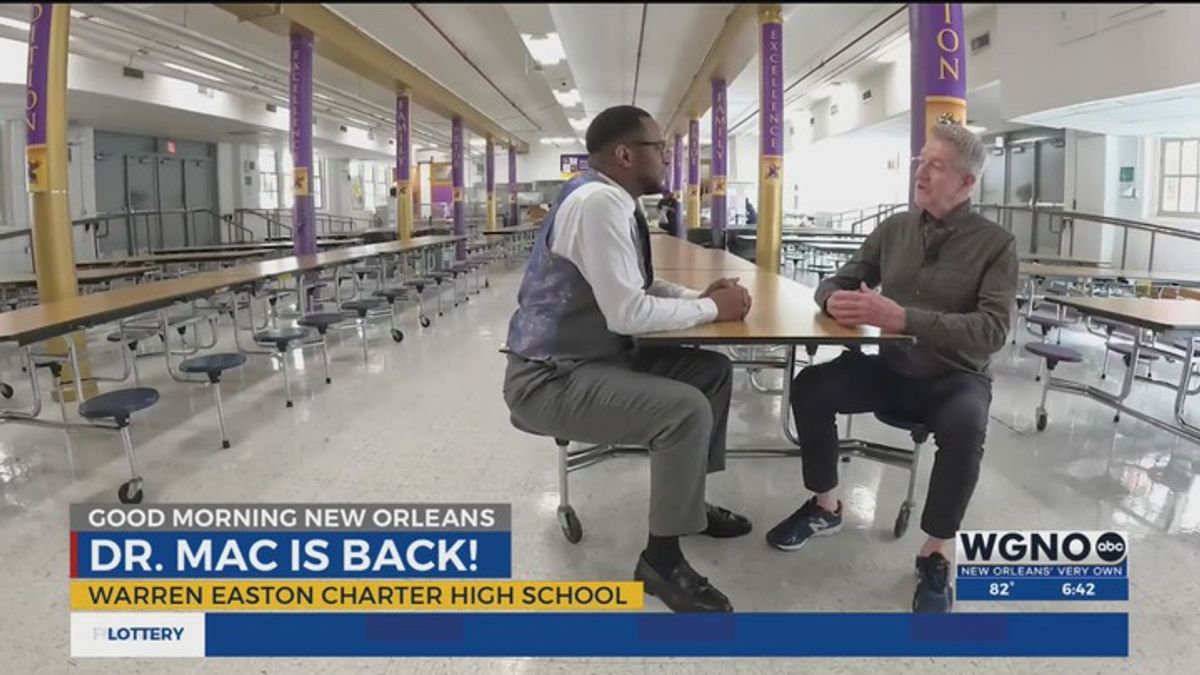 Purple pride is purple power for the New Orleans principal who's back ...