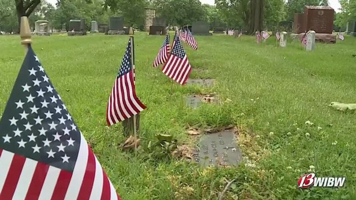 Volunteers honor veterans' graves with flags ahead of Memorial Day ...