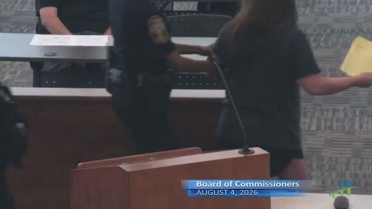 Woman removed from commission meeting in metro Atlanta; Chair says she ...