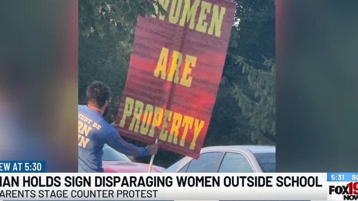 Parents counter-protest man’s offensive signs targeting women outside ...