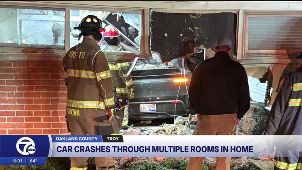 Tesla plows into Troy home, alleged drunk driver narrowly misses couple ...