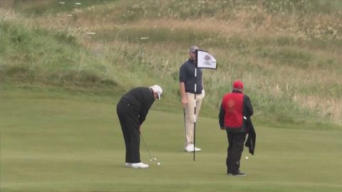 Trump visits golf resorts in Scotland as protesters ask for info on